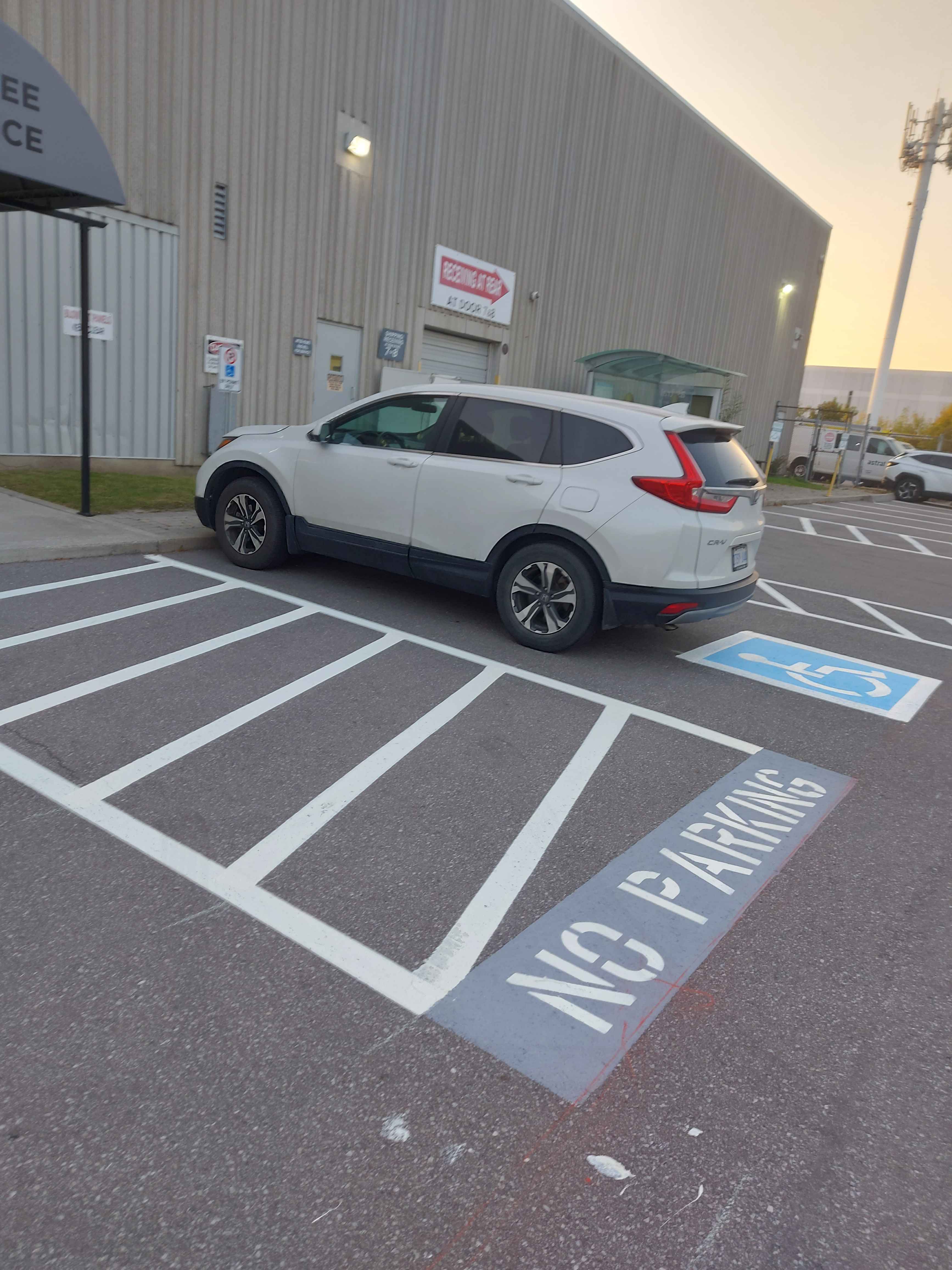 Parking lot pavement marking for EV
